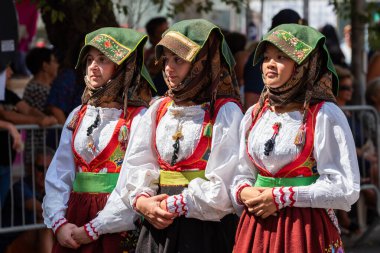 Nuoro, Sardinia, Italy - August 27, 2023: Parade of traditional costumes of Sardinia on the occasion of the Feast of the Redeemer of the August 27, 2023 in Nuoro, Sardinia. clipart