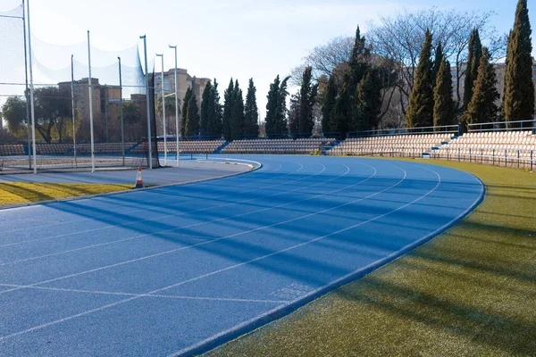 athletics flooring in front of a hammer throw field in a sports center