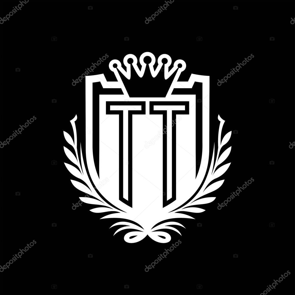 TT Letter logo heraldic shield shape with crown, vintage shield on black background template design