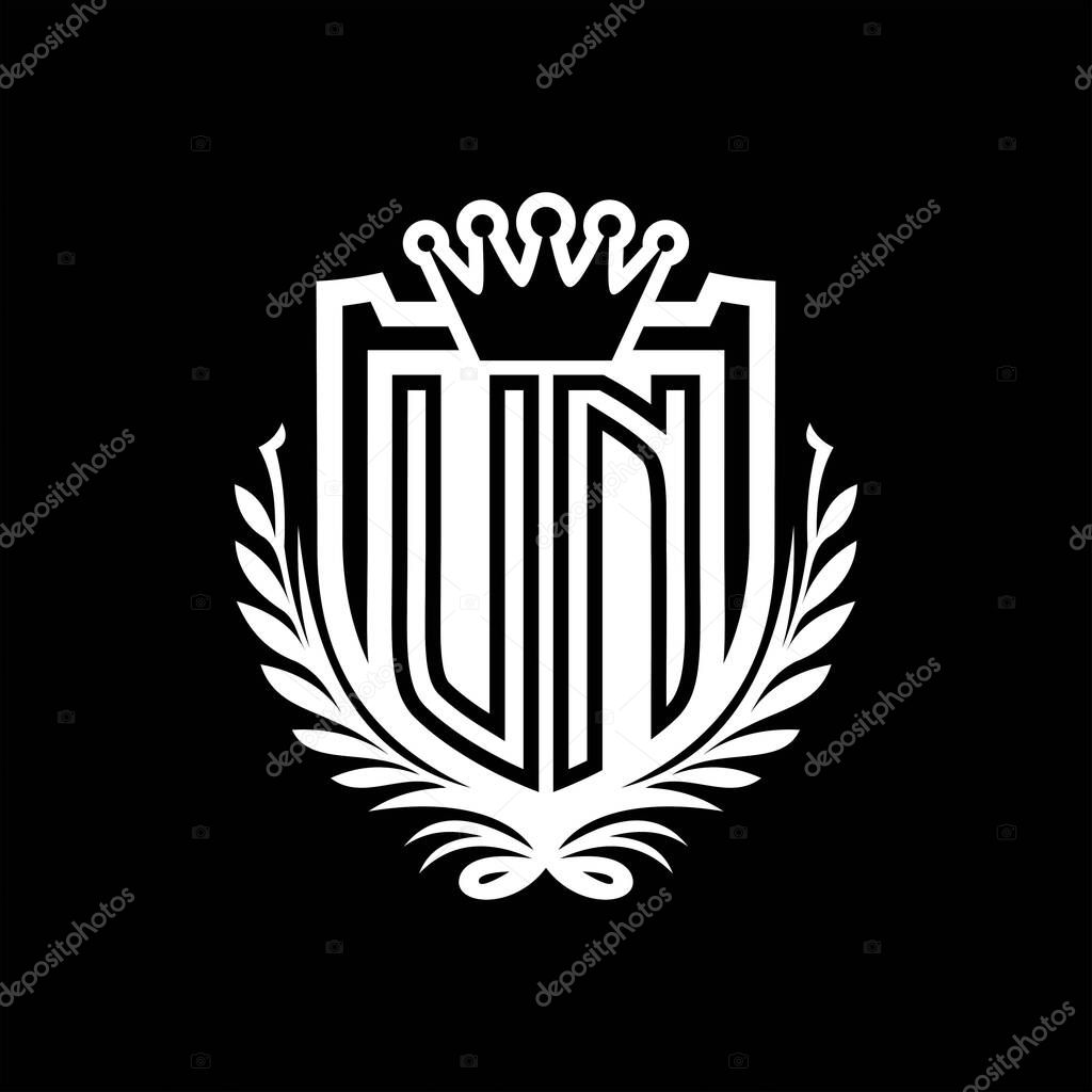 UN Letter logo heraldic shield shape with crown, vintage shield on black background template design