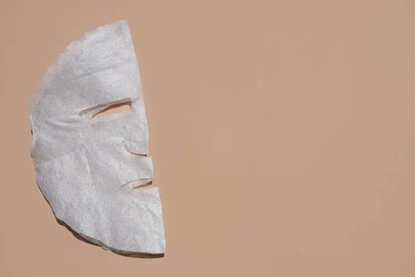 Maschera Viso Tessuto Sfondo Beige Concetto Cura Della Pelle Posto — Foto Stock