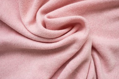 Pembe kaşmir kazağın dokusu. Üst görünüm, yakın çekim.