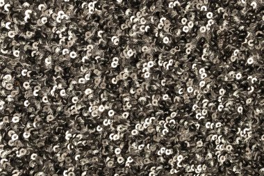 Metalik pullu parlak kumaş dokusu. Düz yat, yakın plan..