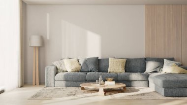 İçinde yastıklar, ahşap paneller, dekorlu masa, yer lambası ve halı olan büyük mavi bir kanepe.