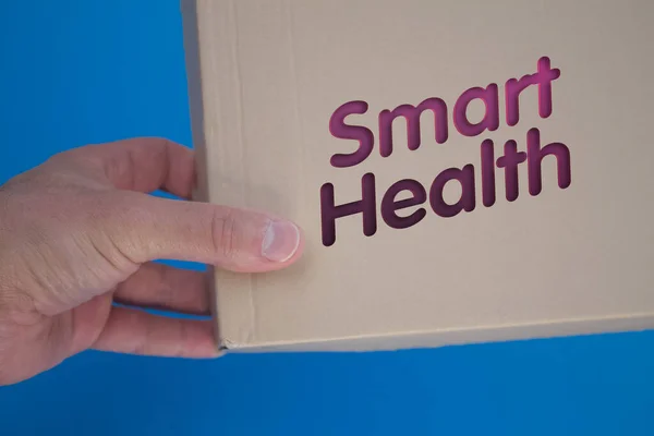 Smart Health word with cardboard box. Brown folded card box.