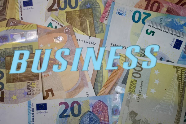 お金でビジネスの言葉 紙幣の種類が異なる紙幣の背景 — ストック写真
