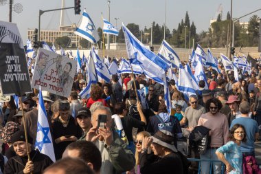 JERUSALEM, ISRAEL - February 20 2023: Israelis protest near the Knesset against plans by prime minister Benjamin Netanyahu new government to trample the legal clipart