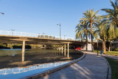 Valencia, Spain. Park in the former riverbed of the Turia River. Early spring. clipart