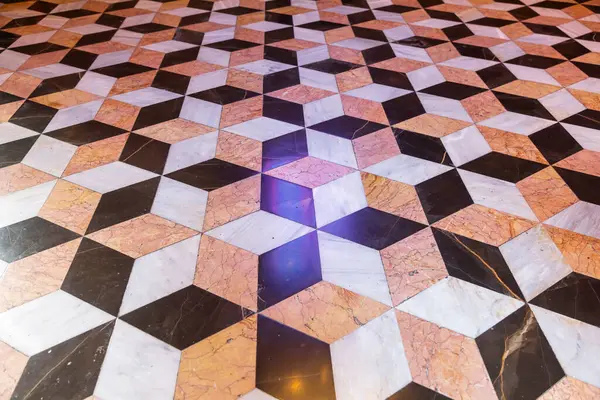 stock image Geometric tile pattern on the floor of the Silk Exchange in Valencia. Optical illusion.