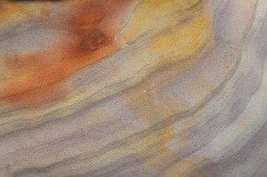 Striped slopes of natural stone mountain walls background