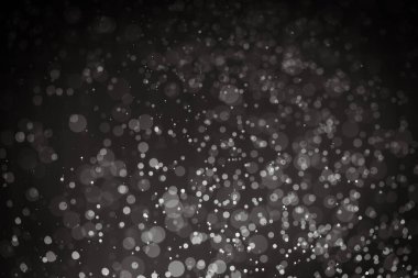 Siyah arkaplanı olan soyut siyah bokeh