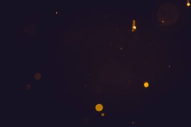 Siyah arkaplanda koyu soyut altın bokeh parıltısı