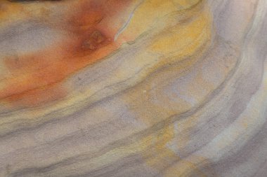 Striped slopes of natural stone mountain walls background