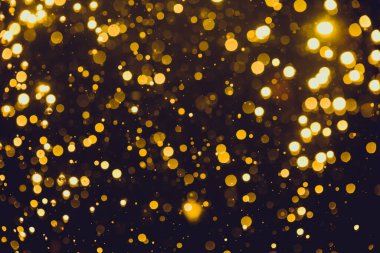 Siyah arkaplan ile soyut altın bokeh