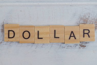 Dollar wooden letters on wood vintage background