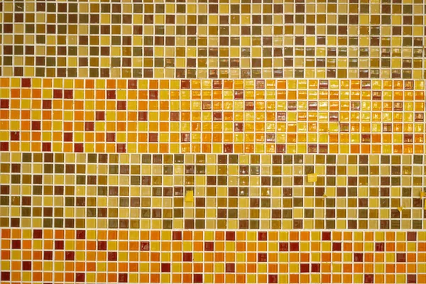 Orange patterned mosaic wall background