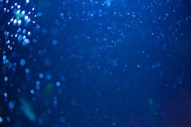 Abstract blue defocus bokeh glitter vintage lights with black background