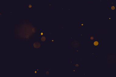 Siyah arkaplanda koyu soyut altın bokeh parıltısı