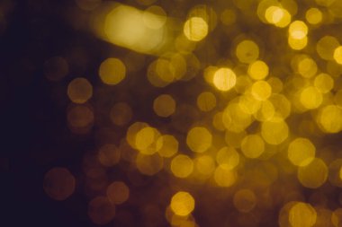 Soyut dekorasyon Bokeh bayramında siyah arka planda parlayan ışıklar