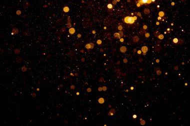 Siyah arkaplan ile soyut altın bokeh