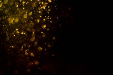 Siyah arkaplan ile soyut altın bokeh