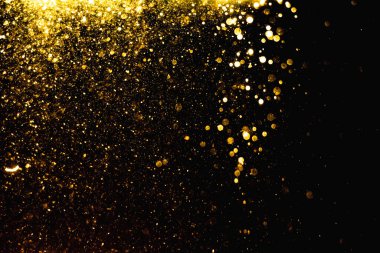 Arkaplanı kutlamak için bulanık altın bokeh yıldızlarını kullan