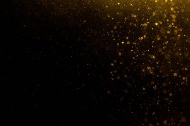 Arkaplanı kutlamak için bulanık altın bokeh yıldızlarını kullan