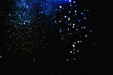 Kutlama arka planı için bulanık mavi bokeh 'in ışıldayan yıldızları