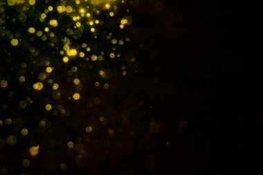 Siyah arkaplan ile soyut altın bokeh