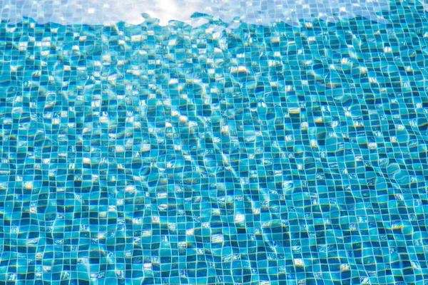 Blue aqua in swimming pool with rippled water
