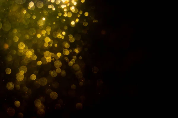 stock image Abstract gold bokeh with black background