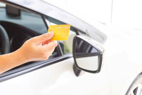 stock image Closed up hand use credit card on car to pay for fuel