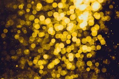 Siyah arkaplan ile soyut altın bokeh