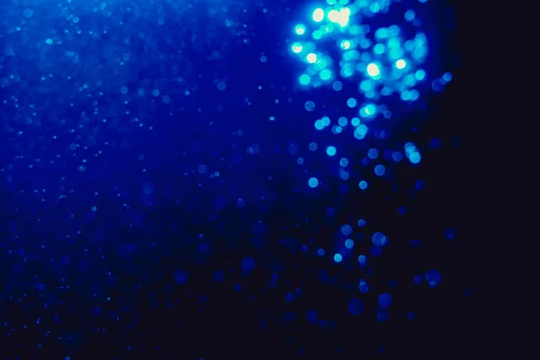Bintang Berkilauan Dari Blur Blue Bokeh Digunakan Untuk Merayakan Latar — Stok Foto