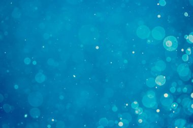 Soyut bulanık mavi bokeh daireleri renkli sanat ve tasarım arka planı için kullanılır