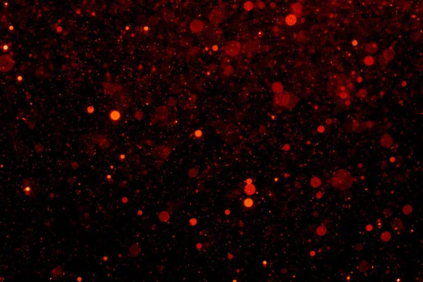 黒い背景のライトの赤いボケ — ストック写真