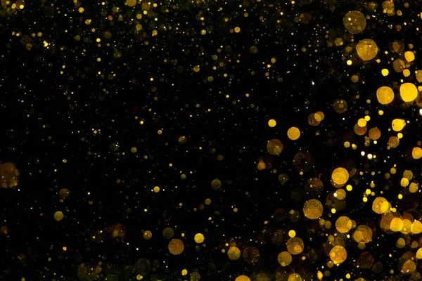圣诞背景下的金黄相间的浅色纹理闪光 — 图库照片