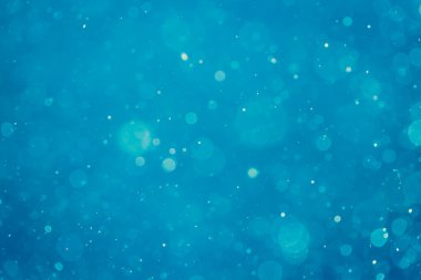 Soyut bulanık mavi bokeh daireleri renkli sanat ve tasarım arka planı için kullanılır