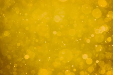 Soyut bulanık altın bokeh çemberleri renkli sanat ve tasarım arka planı için kullanılır