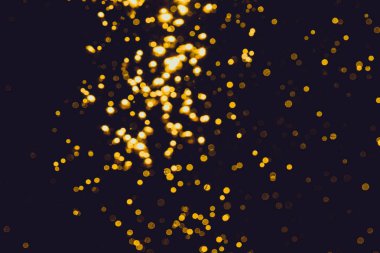 Siyah arkaplan ile soyut altın bokeh