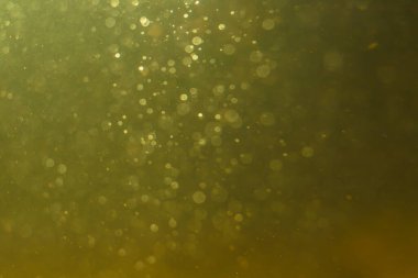 Altın arka planda soyut parıltılı altın bokeh