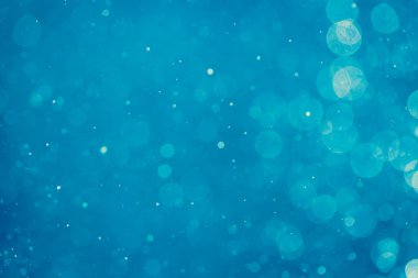 Soyut bulanık mavi bokeh daireleri renkli sanat ve tasarım arka planı için kullanılır