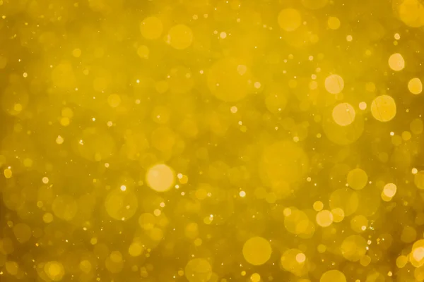 Abstract blur gold bokeh circles use for colorful art and design background