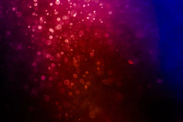 stock image pink bokeh of lights  on black background