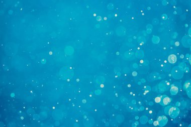 Soyut bulanık mavi bokeh daireleri renkli sanat ve tasarım arka planı için kullanılır