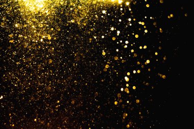Arkaplanı kutlamak için bulanık altın bokeh yıldızlarını kullan
