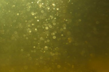 Altın arka planda soyut parıltılı altın bokeh