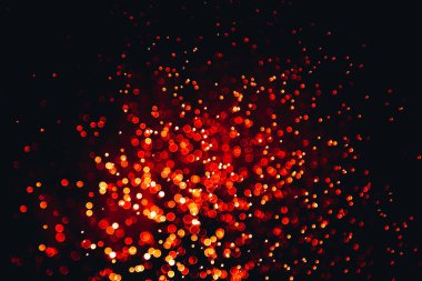 Siyah arkaplan ile soyut kırmızı bokeh dokusu