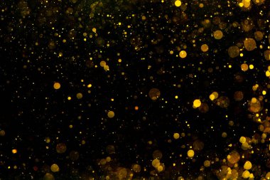 Altın ve sarı bokeh desenli pırıltılı Noel arkaplanı