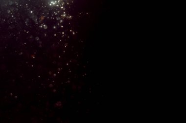 Soyut glitter bokeh siyah arka plan üzerine